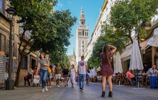 SEVILLE ANDALUSIA, SPAIN - OCTOBER 11: Large number of tourists by the environment of the Cathedral of Seville, during the Puente del Pilar to 11 October 2021 in Seville, Spain. The occupation of the hotels of Seville are at 80 percent compared to those of 2019, before the Covid-19 pandemic. (Photo By Eduardo Briones/Europa Press via Getty Images)